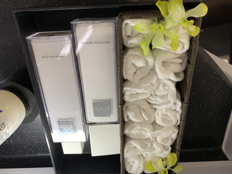 a white towels and a box of soap
