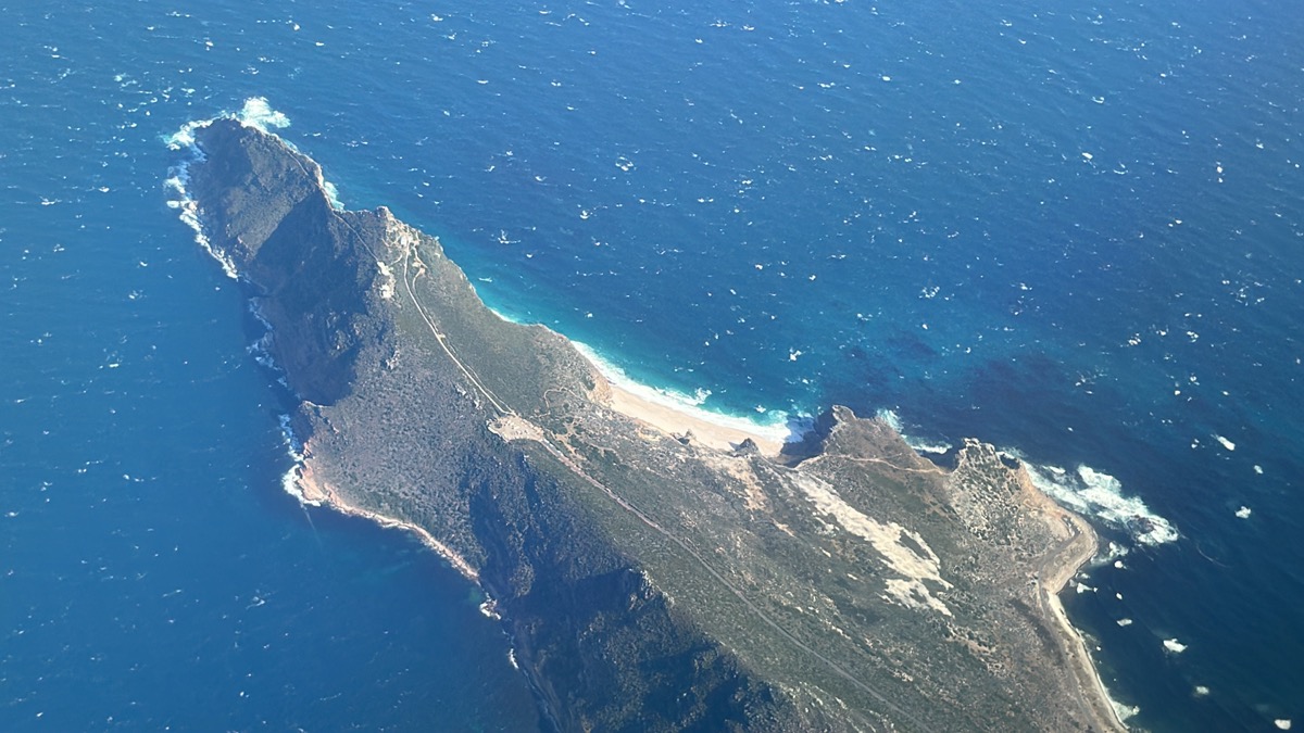 an aerial view of a rocky island