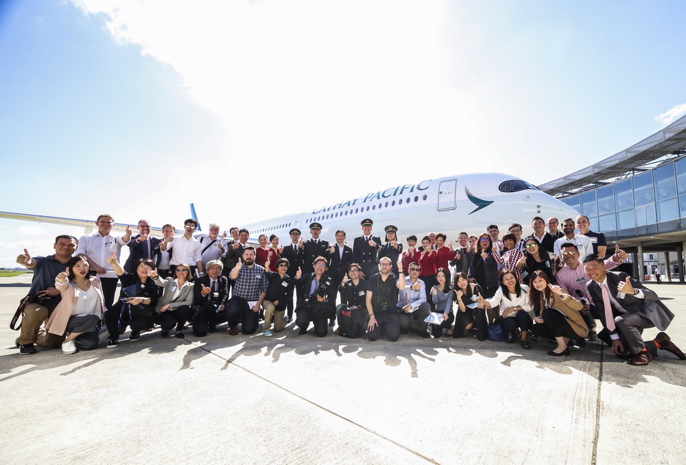 Group photo in front of the new Cathay A350-1000
