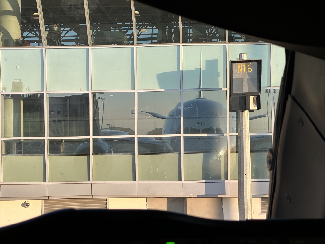 a window of a building with a plane in it