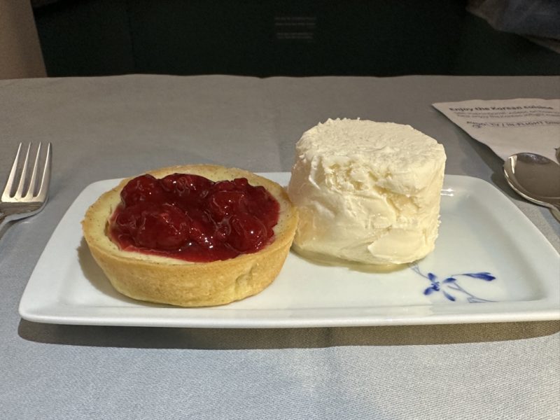 a plate with a pastry and a scoop of ice cream