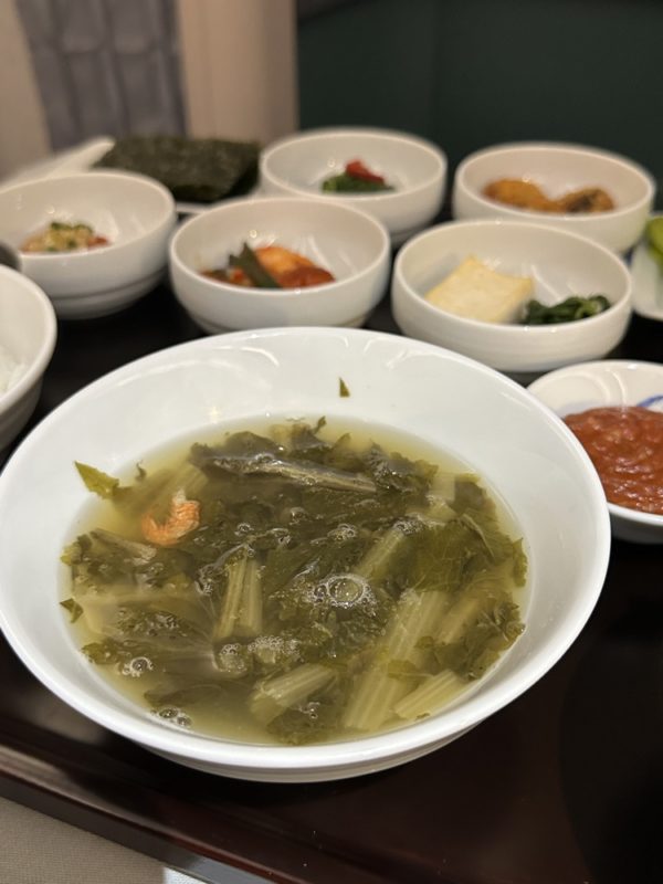 a bowl of soup with various foods in it