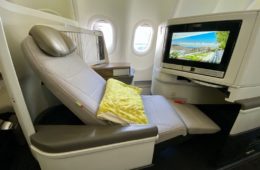 a seat in an airplane with a television