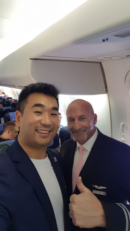 two men standing in a plane